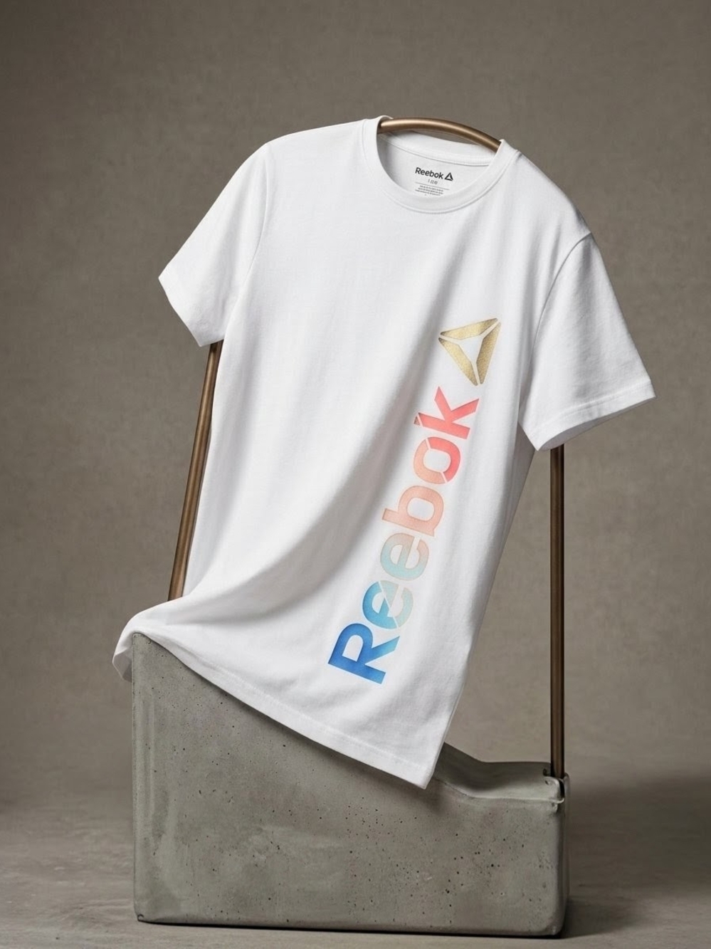 Reebok White Tee with Blue-to-Pink Gradient Logo and Gold Emblem